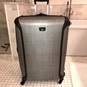 Large Tumi “Tegra” suitcase